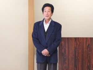 あいさつする荒井部会長（2月18日）